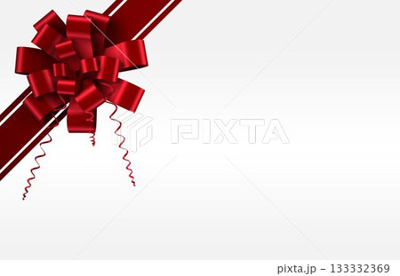 Glossy red bow is showing curled tails, angled stripes on white-gray gradient backdrop, copy space 133332369