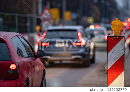 evening traffic jam during road repairs, ntense traffic flow of in cars rush hours evening traffic jam during road repairs, ntense traffic flow of in cars rush hours 133332779