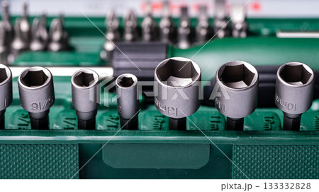 Interchangeable screwdriver set with different types of metal steel heads and bits, closeup Interchangeable screwdriver set with different types of metal steel heads and bits, closeup 133332828