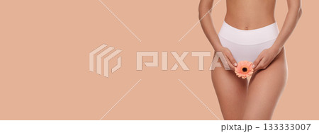 Showcasing a woman promoting body care with a flower 133333007