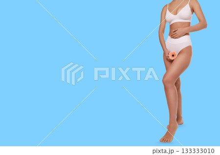 A person cradles a flower, showcasing self-care 133333010