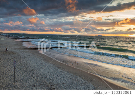 Russia, Zelenogradsk - July 26, 2022: Curonian Spit wth Baltic sea coastline on sunset 133333061