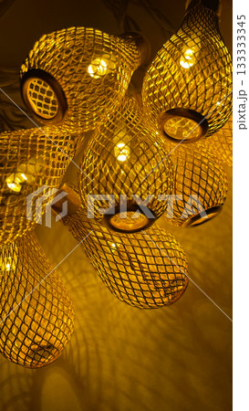 Warm golden string lights with a beautiful metallic mesh texture creating a cozy and festive atmosphere 133333345