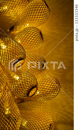 Warm golden string lights with a beautiful metallic mesh texture creating a cozy and festive atmosphere 133333346