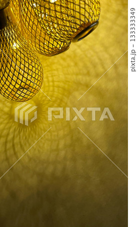 Warm golden string lights with a beautiful metallic mesh texture creating a cozy and festive atmosphere Warm golden string lights with a beautiful metallic mesh texture creating a cozy and festive atmosphere 133333349