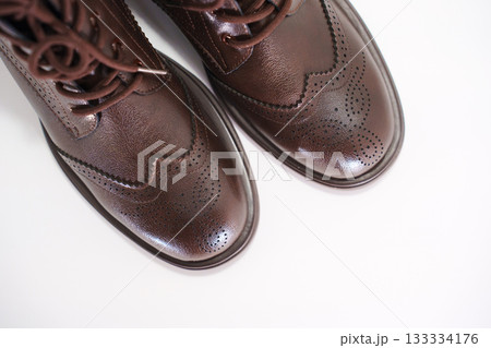 Stylish brown shoes with detailed stitching design Stylish brown shoes with detailed stitching design 133334176