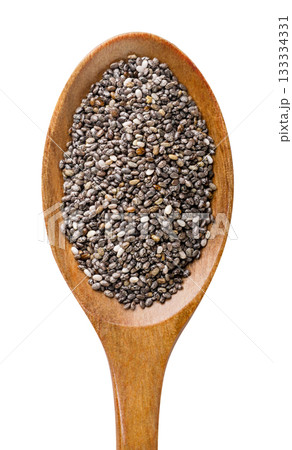 Chia seeds in a wooden spoon isolated on a white. Top view 133334331