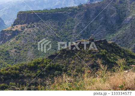 Mountain landscape photo featuring ruined Kayan Fortress placed on top of a hill 133334577