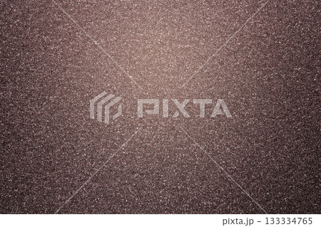 Brown glitter textured paper showing gleaming particles, suitable for festive, celebration, or luxurious concepts Brown glitter textured paper showing gleaming particles, suitable for festive, celebration, or luxurious concepts 133334765