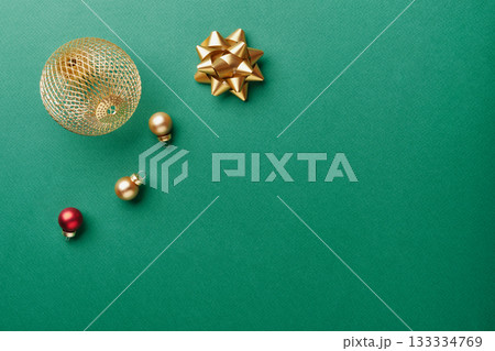 Gold ornaments and bow creating festive christmas and new year holiday flat lay 133334769