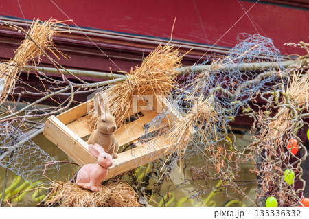 Easter decoration with Easter bunnies and Easter eggs on a house 133336332