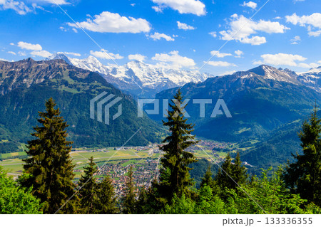 Breathtaking aerial view of Interlaken and Swiss Alps from Harder Kulm viewpoint, Switzerland Breathtaking aerial view of Interlaken and Swiss Alps from Harder Kulm viewpoint, Switzerland 133336355