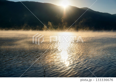 Sunrise over the mountain with reflection on the lake 133336676