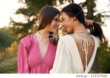 Conception of passion. Lovely lesbian couple are together outdoors in nature Conception of passion. Lovely lesbian couple are together outdoors in nature 133337688