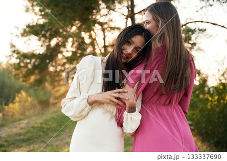 Conception of passion. Lovely lesbian couple are together outdoors in nature 133337690