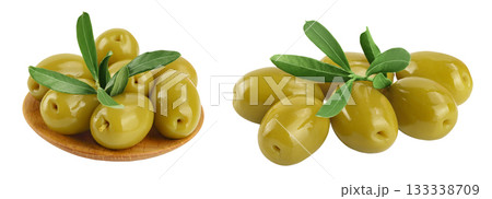 Green olives with leaves in wooden bowl isolated on a white background with full depth of field. 133338709
