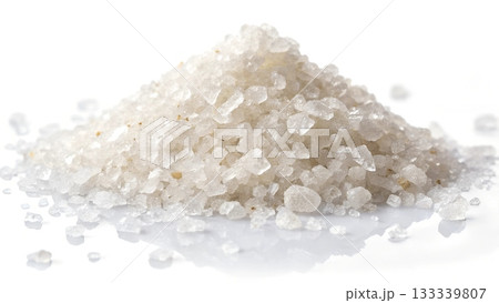 A pile of coarse white sea salt crystals with a reflective white background A pile of coarse white sea salt crystals with a reflective white background 133339807