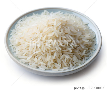 A bowl of uncooked white rice grains with a light blue rim isolated on a white background A bowl of uncooked white rice grains with a light blue rim isolated on a white background 133340033