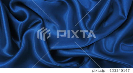 Smooth elegant blue silk or satin luxury texture as abstract background. Luxurious Christmas background or New Year background design 133340147