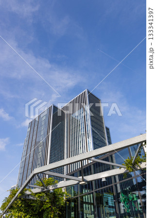 Modern Glass Office Tower, Low Angle Urban Architecture Modern Glass Office Tower, Low Angle Urban Architecture 133341397