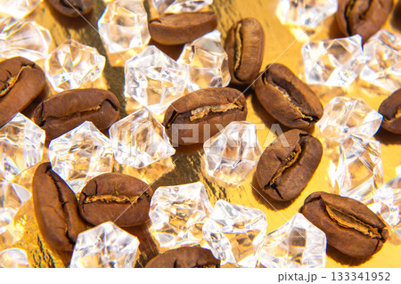 A stunning close-up of roasted coffee beans mingled with sparkling ice cubes A stunning close-up of roasted coffee beans mingled with sparkling ice cubes 133341952