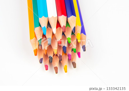 A row of vibrant colored pencils in a wave design on a white background A row of vibrant colored pencils in a wave design on a white background 133342135