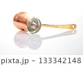 Shiny copper cezve with a golden handle, used for brewing Turkish coffee 133342148