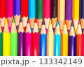 Sharpened colored pencils in a colorful layered design on a white backdrop 133342149