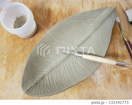 Creating a Detailed Clay Leaf Sculpture with Tools Creating a Detailed Clay Leaf Sculpture with Tools 133342773