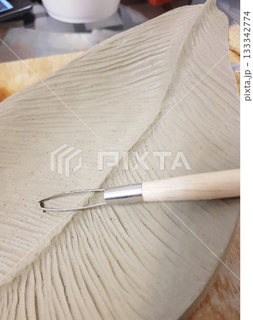 Creating a Detailed Clay Leaf Sculpture with Tools Creating a Detailed Clay Leaf Sculpture with Tools 133342774