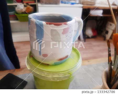 Artistic Pottery Mug: Studio Scene Crafting Process 133342786
