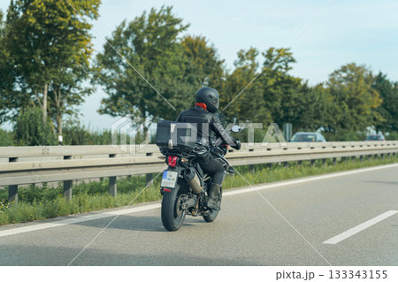 biker on the road biker on the road 133343155