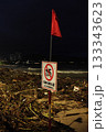 Rainy season storm damage on Nha Trang beach with “No Swimming” warning sign 133343623