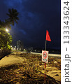 Rainy season storm damage on Nha Trang beach with “No Swimming” warning sign 133343624