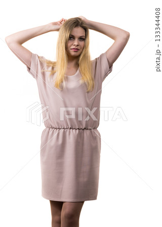 Female wearing casual pink tunic dress Female wearing casual pink tunic dress 133344408