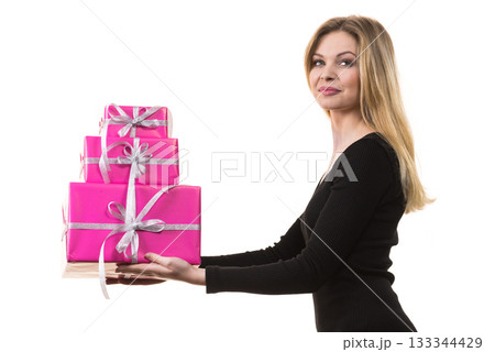 Girl holding stack of pink gift boxes 133344429