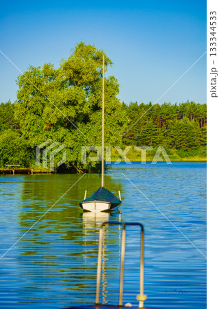 Yacht on lake in Tuchola Forests, Poland. Yacht on lake in Tuchola Forests, Poland. 133344533