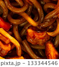 Udon stir-fry noodles with chicken and vegetables, close up. 133344546