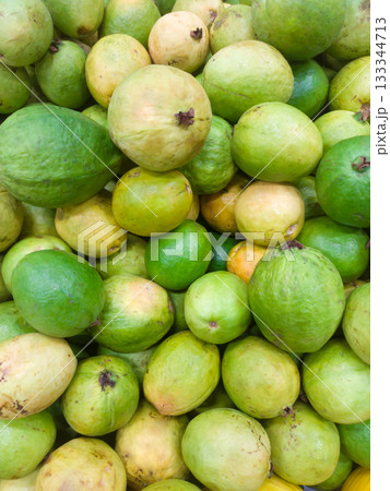 A pile of guavas stacked on a supermarket shelf A pile of guavas stacked on a supermarket shelf 133344713