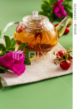Medicinal rosehip tea with flowers and berries 133345230