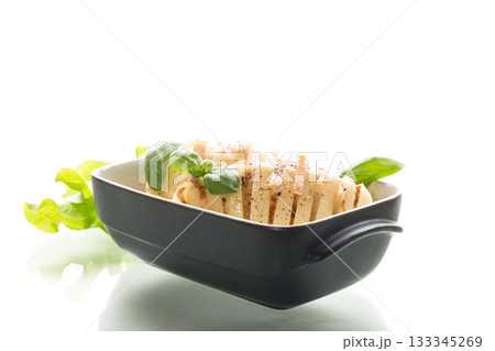 Traditional Ukrainian recipe for potatoes with lard isolated on white background Traditional Ukrainian recipe for potatoes with lard isolated on white background 133345269