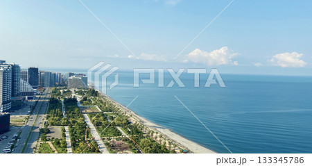 Beautiful public park, sea coast with beach and blue sky 133345786