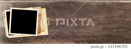Horizontal banner with two retro photo, vintage envelope and cards on wooden board. Nostalgic scrapbooking mockup template is perfect way to express creativity and evoke a sense of warm memories 133346705
