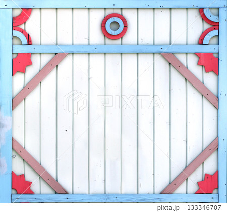 Vintage wooden shutter with peeling paint and rustical naive handmade decor. Retro wood door with simple hand-carved decor. Mock up template. Copy space for text Vintage wooden shutter with peeling paint and rustical naive handmade decor. Retro wood door with simple hand-carved decor. Mock up template. Copy space for text 133346707