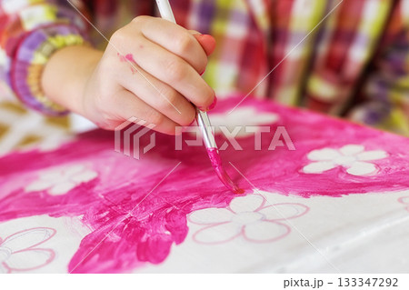 children's hands draw a house for dolls. child creativity Place for text 133347292