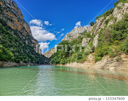 Boat trip on turquoise water of mountain canyon, Verdon Gorge in french Alps, Provence France. Boat trip on turquoise water of mountain canyon, Verdon Gorge in french Alps, Provence France. 133347600