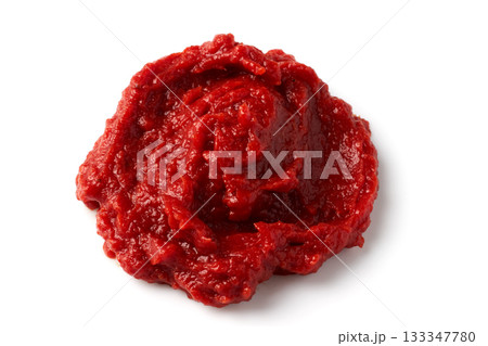 A pile of red tomato paste isolated on white background. A pile of red tomato paste isolated on white background. 133347780
