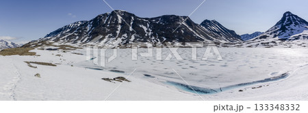 Snowy Leirdalen mountain landscape with clear blue sky 133348332