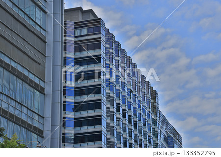 Glass Office Building Facade Shaped by Repeating Blue Windows Nov 15 2025 133352795