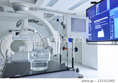 High-tech medical imaging room equipped for diagnostic procedures and patient monitoring 133352905
